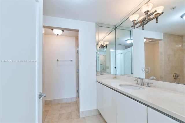 full bathroom with tile patterned flooring, vanity, and baseboards