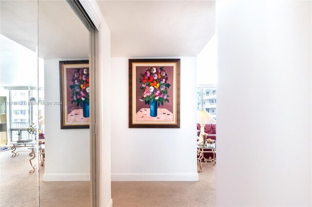 1408 Brickell Bay Dr Unit 1415 & 1416, Miami, FL 33131 - corridor featuring carpet, baseboards, and plenty of natural light