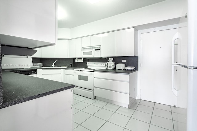 kitchen featuring white appliances, tasteful backsplash, sink, light tile patterned flooring, and white cabinetry