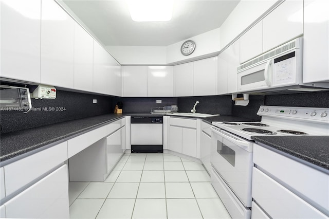 kitchen featuring decorative backsplash, light tile patterned floors, white cabinetry, sink, and white appliances