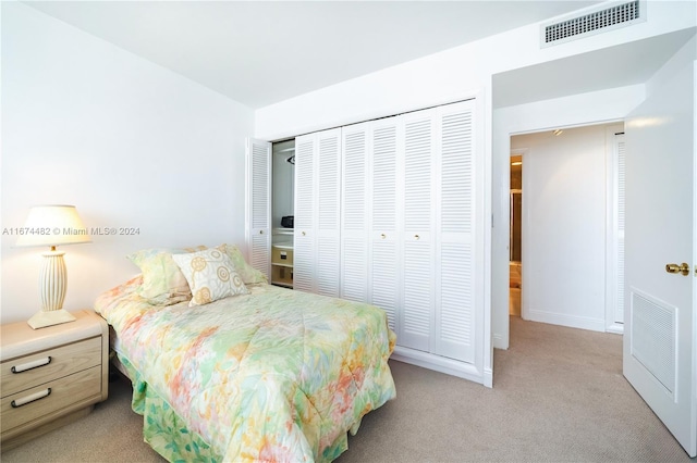 carpeted bedroom featuring a closet