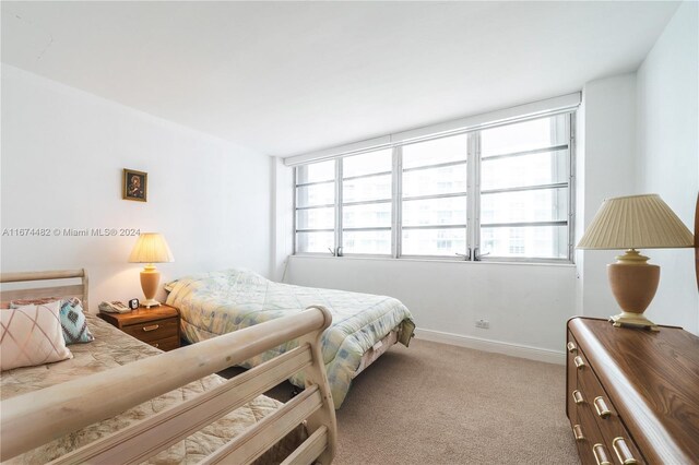 1408 Brickell Bay Dr Unit 1415 & 1416, Miami, FL 33131 - carpeted bedroom with baseboards