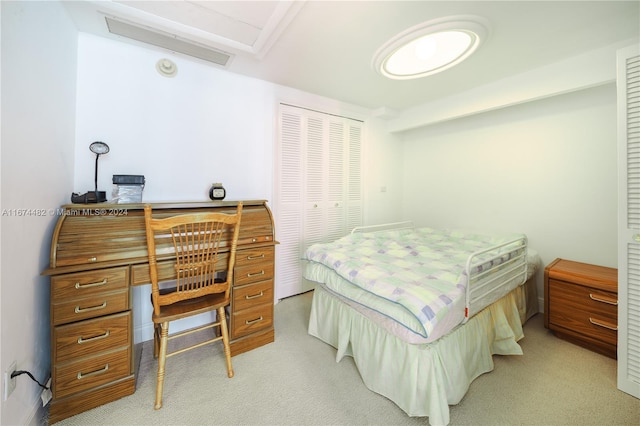 carpeted bedroom with a closet