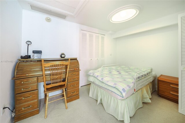 1408 Brickell Bay Dr Unit 1415 & 1416, Miami, FL 33131 - bedroom featuring an office area, light carpet, and a closet