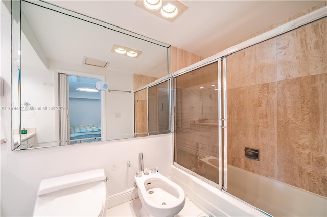 bathroom with enclosed tub / shower combo, a bidet, and toilet