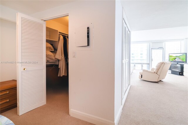 1408 Brickell Bay Dr Unit 1415 & 1416, Miami, FL 33131 - hall featuring light carpet, baseboards, and electric panel