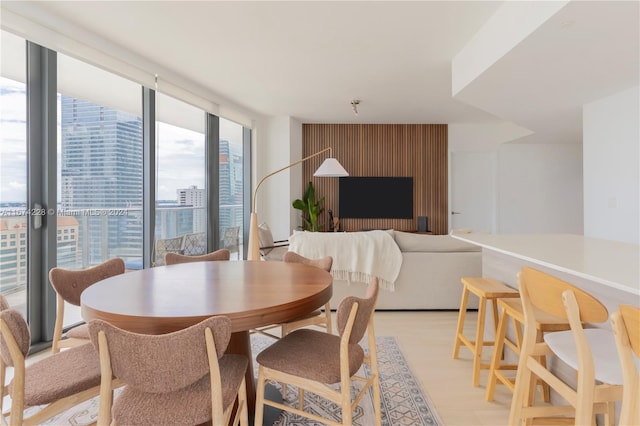 dining space with light wood-type flooring