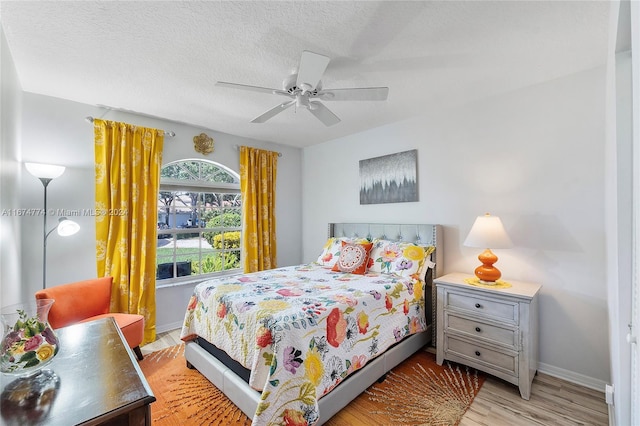 11088 Indian Lake Cir, Boynton Beach, FL 33437 - bedroom with wood finished floors, ceiling fan, and a textured ceiling