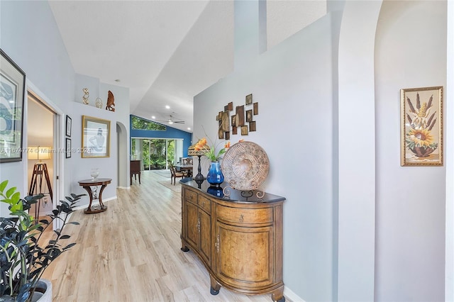 11088 Indian Lake Cir, Boynton Beach, FL 33437 - hallway with lofted ceiling and light wood-style floors