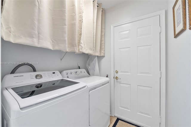 laundry room featuring washing machine and dryer