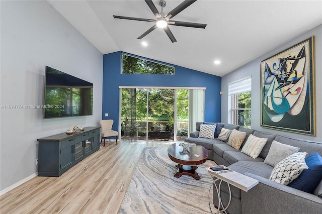 living room with lofted ceiling, light hardwood / wood-style floors, and ceiling fan