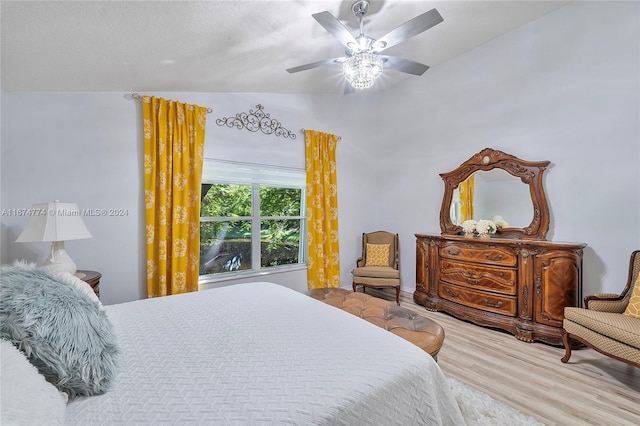 bedroom featuring vaulted ceiling, hardwood / wood-style flooring, and ceiling fan