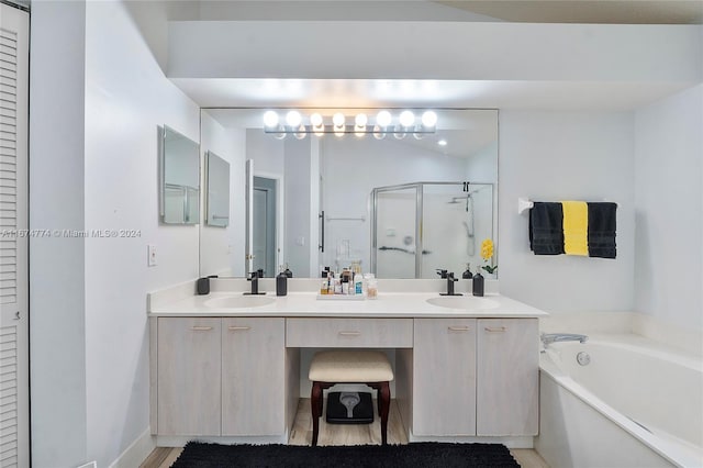 bathroom with vanity and plus walk in shower