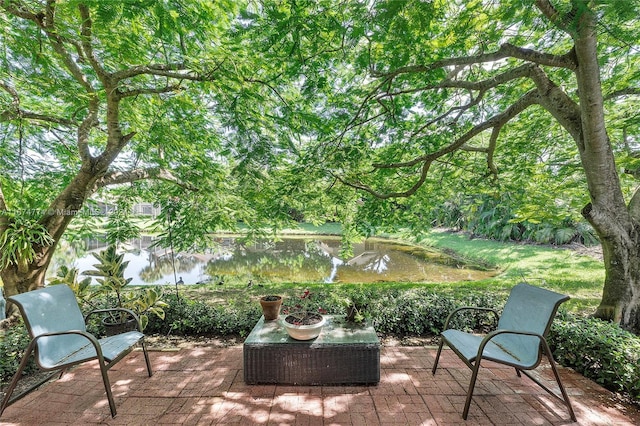 view of patio featuring a water view