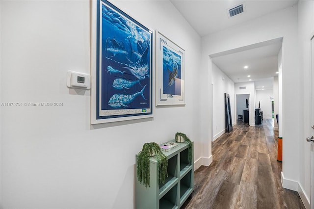 hallway with dark hardwood / wood-style flooring