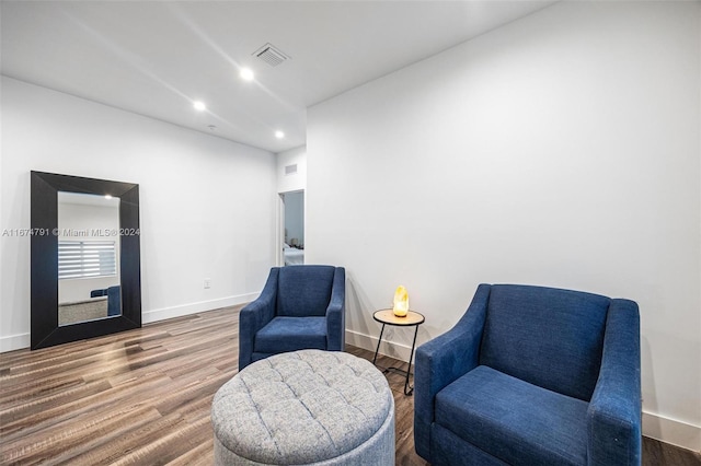 living area with hardwood / wood-style flooring