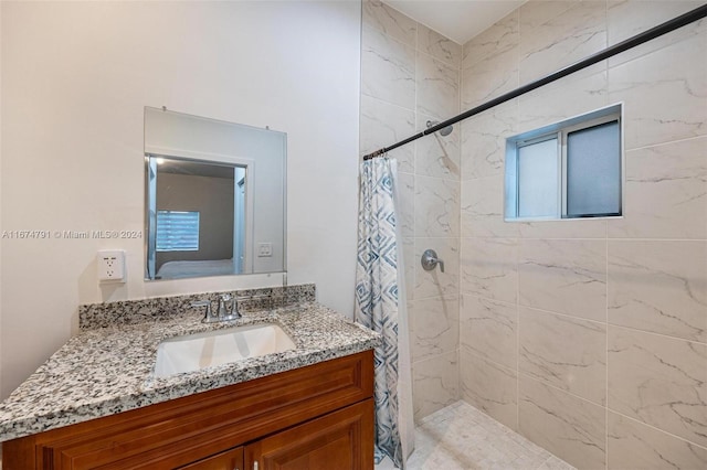 bathroom featuring vanity and a shower with curtain