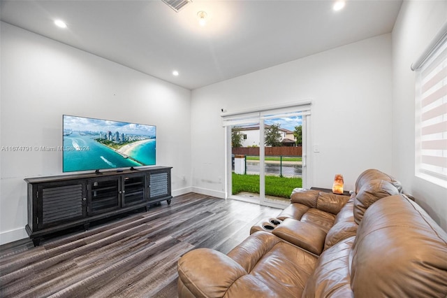 living room featuring dark wood-type flooring