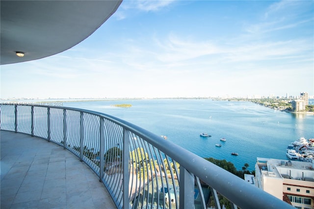 balcony featuring a water view