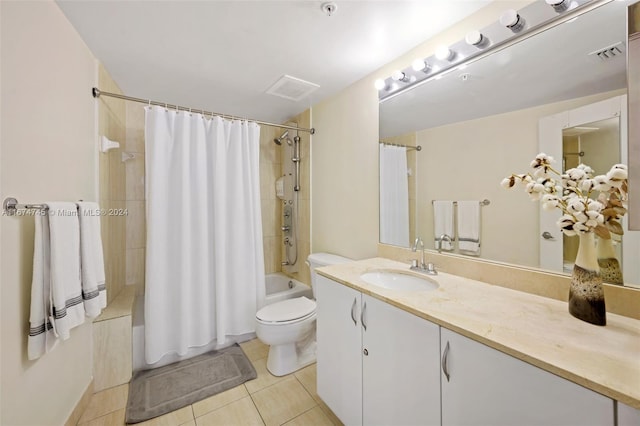 full bathroom featuring tile patterned floors, vanity, toilet, and shower / tub combo