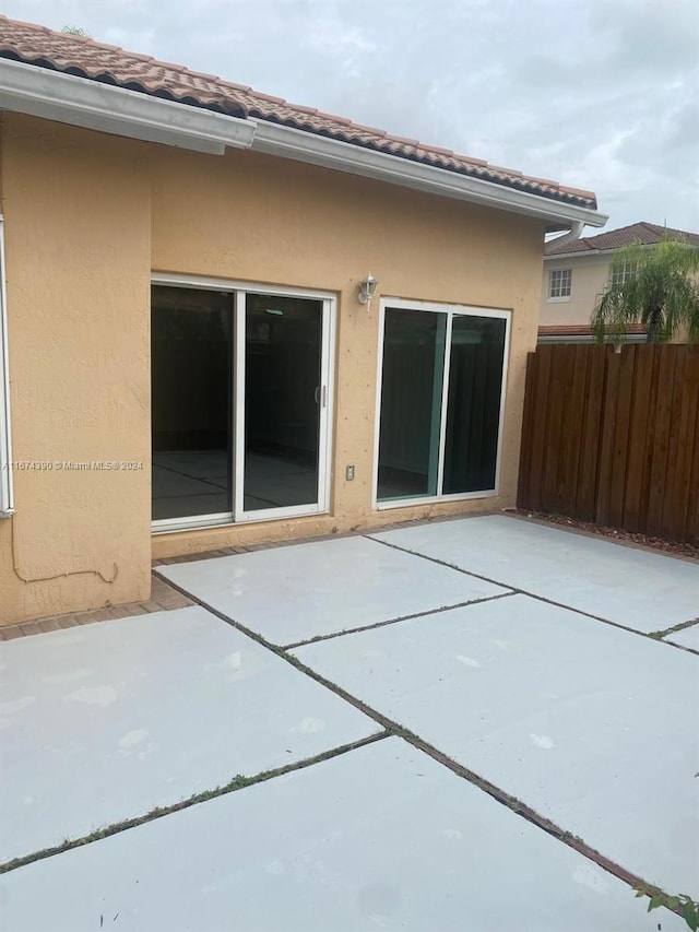 rear view of house featuring a patio area