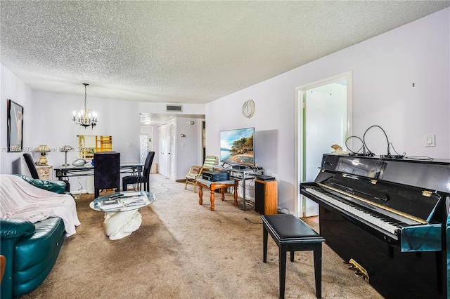 carpeted living room with a textured ceiling and a notable chandelier