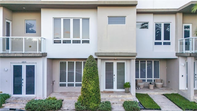 back of property featuring french doors