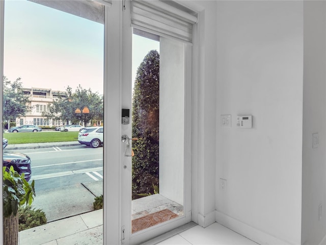 entryway featuring light tile patterned flooring