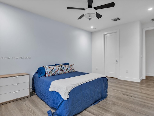 bedroom with light wood-type flooring and ceiling fan