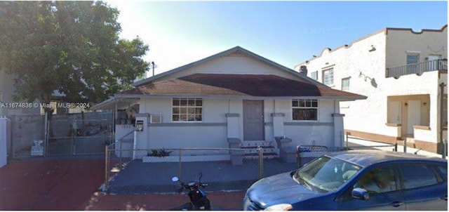 view of front of home featuring a balcony