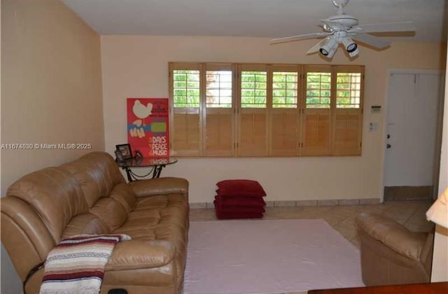 1900 NE 8th Ct Unit 203, Fort Lauderdale, FL 33304 - living area with ceiling fan, a wealth of natural light, and tile patterned floors
