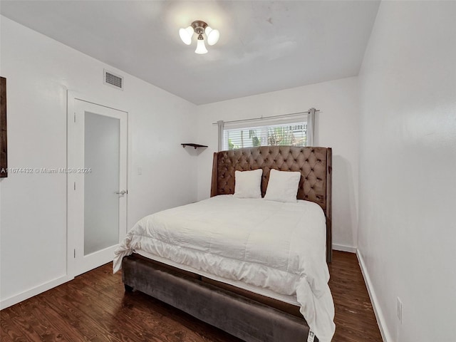 bedroom featuring dark wood-type flooring