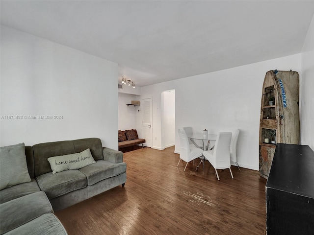 living room with dark hardwood / wood-style floors