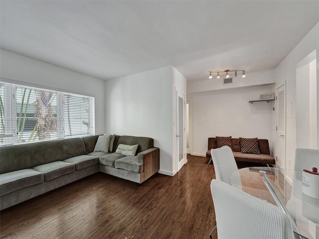 living room with dark hardwood / wood-style flooring