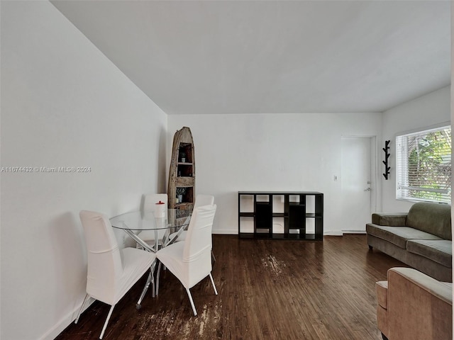 dining room with dark wood-type flooring