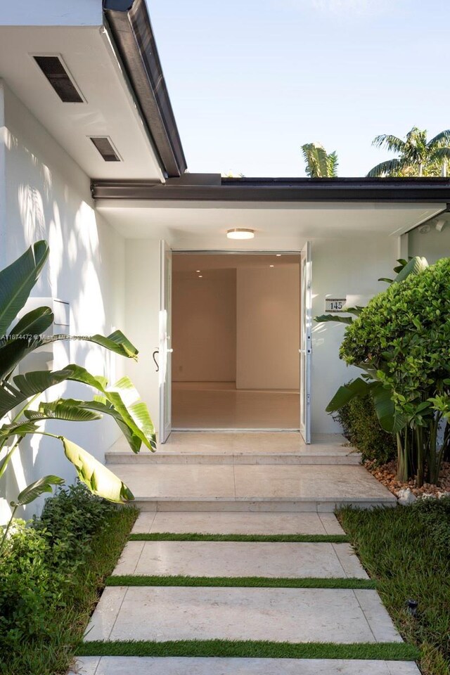145 S Prospect Dr, Coral Gables, FL 33133 - doorway to property with stucco siding