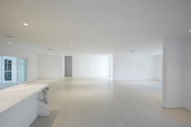 unfurnished room with light hardwood / wood-style floors