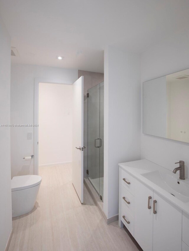 145 S Prospect Dr, Coral Gables, FL 33133 - full bathroom featuring vanity, a stall shower, wood finished floors, and recessed lighting