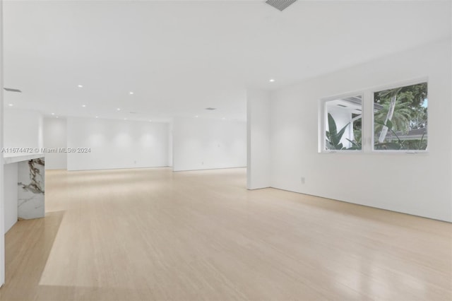 spare room featuring light wood-type flooring