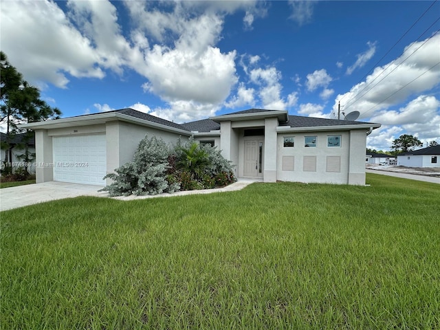 view of front of home featuring a front lawn and a garage