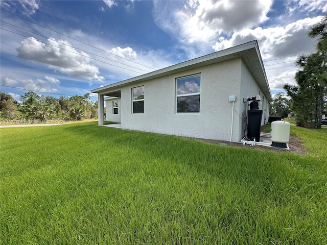 rear view of house with a yard