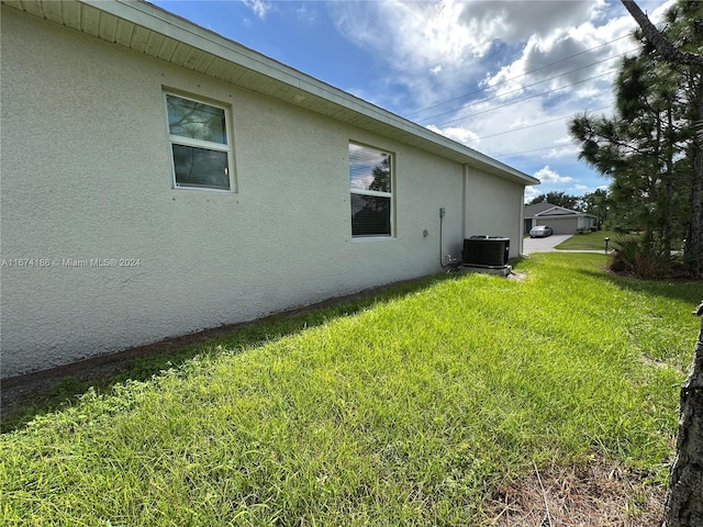 view of home's exterior with a lawn