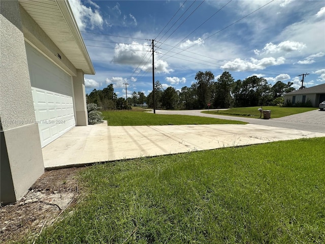 view of yard featuring a garage