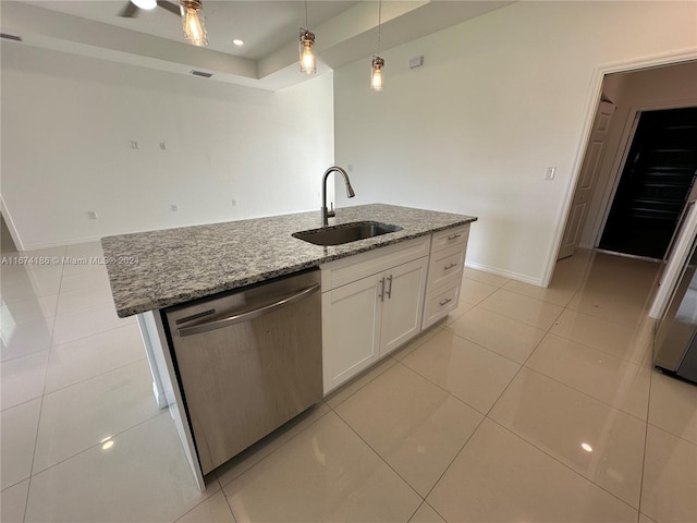 kitchen with dishwasher, a kitchen island with sink, sink, stone counters, and white cabinetry