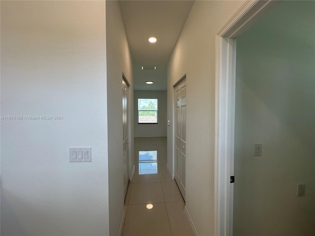 hall with light tile patterned flooring