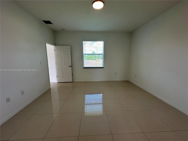 view of tiled spare room