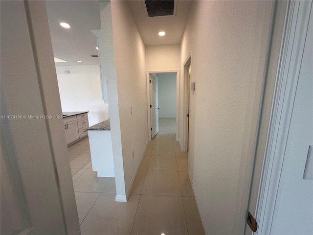 hallway with light tile patterned flooring