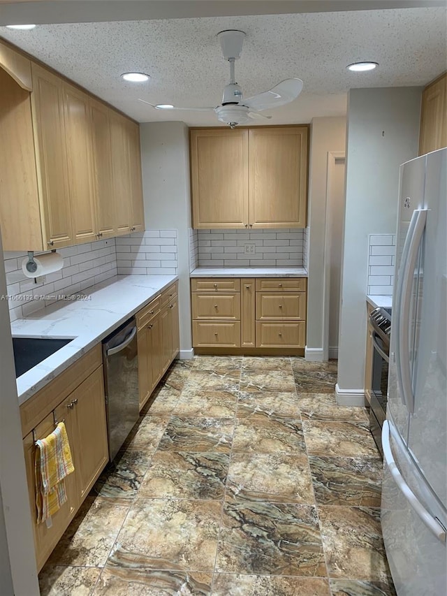 kitchen featuring tasteful backsplash, light brown cabinetry, appliances with stainless steel finishes, a textured ceiling, and ceiling fan