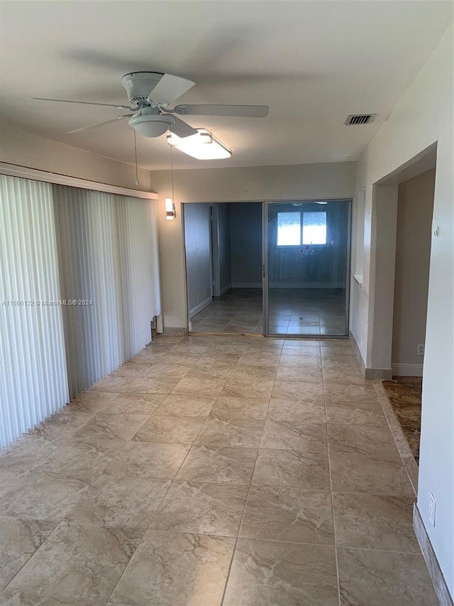 spare room featuring ceiling fan