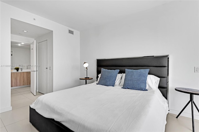 bedroom with light tile patterned floors